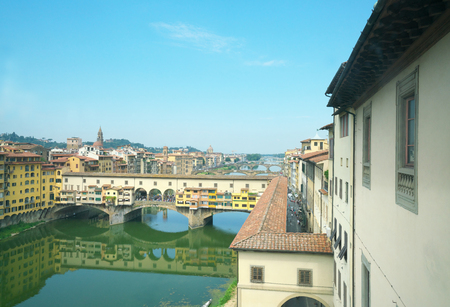 Florence, Italy-July 26, 208: Famous bridge Ponte Vecchio on the river Arno in Florence, Italy.のeditorial素材