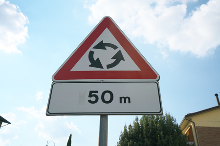 Warning road sign of roundabout, Orvieto, Italyの写真素材