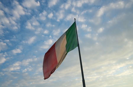 Firenze, Italy-July 27, 2018: National flag of Italy flying in the early morning at Firenze Santa Maria Novella stationのeditorial素材