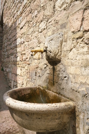 Assisi, Italy-July 28, 2018: Public water fountain, Assisiのeditorial素材