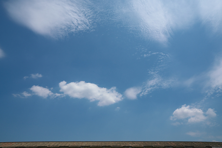 Blue sky above the roof topの写真素材