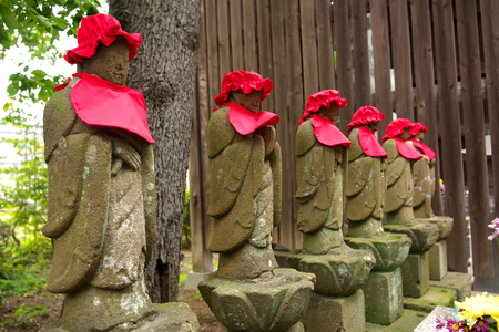 Tokyo, Japan-October 5, 2018: Buddhist guardian deity of children and travelers, or Bodhisattva Jizo, or statue of the Budd Hist deity called Jizo or Ojizo Tokyo, Japan-October 5, 2018: Buddhist guardian deity of children and travelers, or Bodhisattva Jizo, or statue of the Budd Hist deity called Jizo or Ojizo