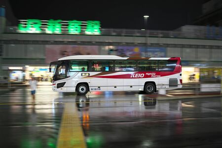 Tokyo, Japan-September 10, 2019: An expressway bus departing from Shinjuku Expressway bus terminal in the rainのeditorial素材