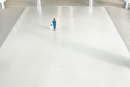 Shanghai, China-September 19, 2019: A walks tourist in Shanghai Pudong international airport second terminal in the morningのeditorial素材