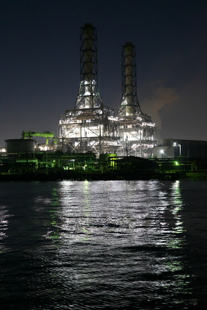 Tokyo,Japan-December 1, 2019: Night View of Heat Power Plants Viewed from a Boat in Kawasaki Show After the Sunsetのeditorial素材