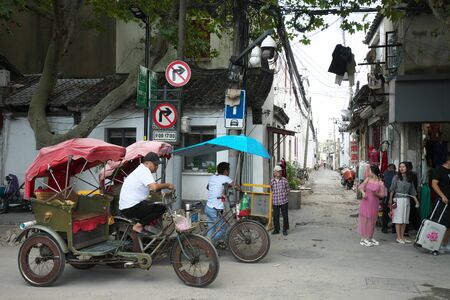 Suzhou,China-September 17, 2019: Traditional Chinese touring cycle rickshaw in Suzhou, Chinaのeditorial素材