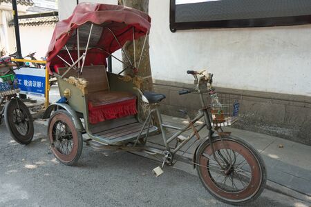 Suzhou,China-September 17, 2019: Traditional Chinese touring cycle rickshaw in Suzhou, Chinaのeditorial素材