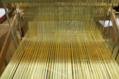 Kyoto,Japan-February 26, 2020: Weaving machine of Nishijin Ori or Nishijin silk fabrics or Nishijin brocade in Kyotoの写真素材