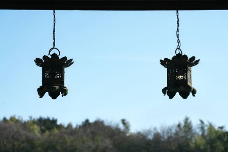 Traditional design Bronze hanging lanterns in a Buddhism templeの写真素材