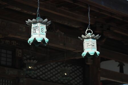 Traditional design Bronze hanging lanterns in a Buddhism templeの写真素材