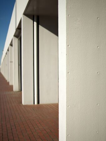 Tokyo,Japan-January 6, 2020: Shallow-focus series of white walls on brick tile pavementの写真素材