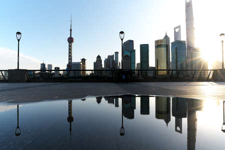 Shanghai,China-September 18, 2019: Reflection of Pudong New Area buildings on a pool of water after the morning rain in Shanghaiのeditorial素材