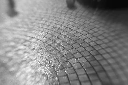 Tokyo,Japan-August 10, 2020: Sudden heavy shower on stone pavementの写真素材