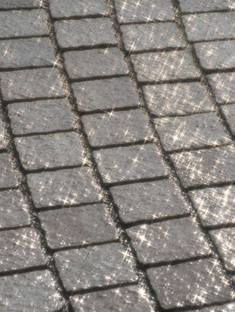 Sudden heavy shower on stone pavementの写真素材