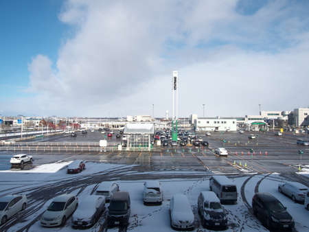 Hokkaido,Japan-November 11, 2020: New Chitose Airport Parking Lot in the snowのeditorial素材