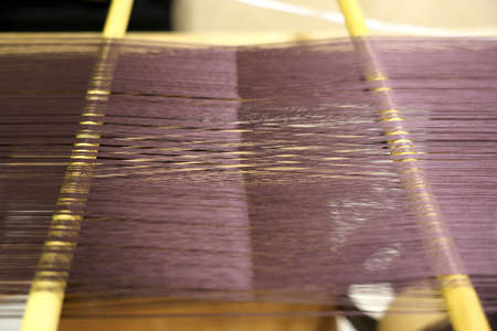Closeup of Nishijin-ori silk yarns. Number of yarns are 2,400.