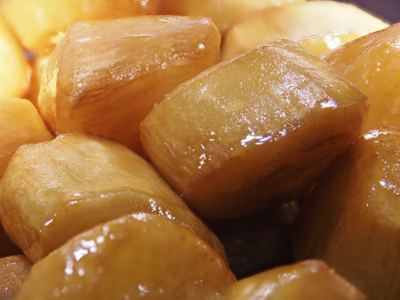 Closeup of Daigakuimo or deep fried sweet potatoes coated with sweet syrupの写真素材