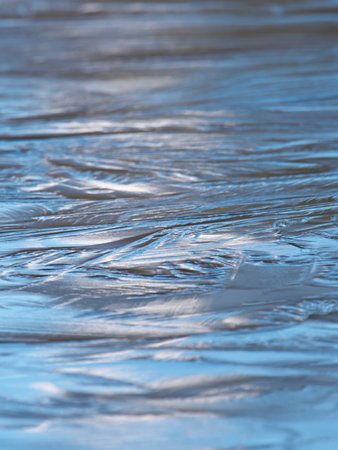 Sunlight on completely frozen lake surface