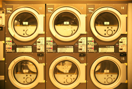 Tokyo,Japan-February 13, 2021: Quiet coin laundry or self-service laundry in the night