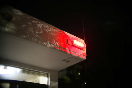 Tokyo,Japan-February 13, 2021: A red light on police box or KOBAN in Tokyo, Japanの写真素材