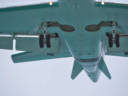Okinawa,Japan - July 2, 2021: Closeup of landing gear of incoming aircraft in Japan