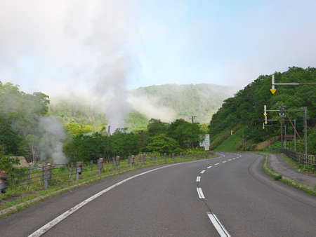 Hokkaido,Japan - June 23, 2021: Steam from Open-air hot spring bath, Kumanoyu, viewed from Shiretoko Crossing Road in Shiretoko National Park, Hokkaido, Japanのeditorial素材