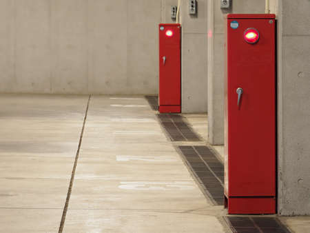 Tokyo,Japan - August 7, 2021: Foam Fire extinguisher boxes in underground parking space
