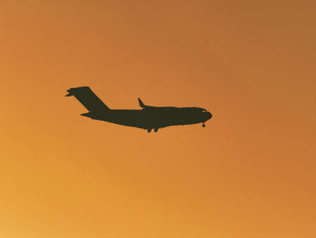 Tokyo,Japan - September 20, 2021:  United States Air Force's Boeing C-17 airplane in action at Yokota Air Base just after the sunset, Tokyo, Japanのeditorial素材