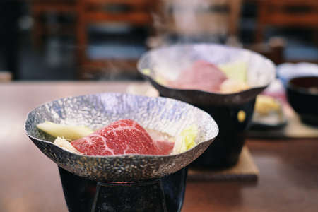 Hyogo,Japan - November 17, 2021: Grilling sukiyaki on small stoveの写真素材