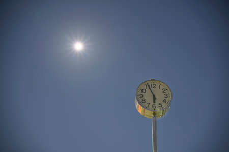 Tokyo,Japan - December 22, 2021: A clock tower under the full moon