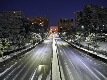 Tokyo,Japan - January 7, 2022: Traffic in the snow at dawn at Tama area in Tokyo, Japanの写真素材