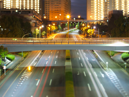 Tokyo, Japan - December 15, 2022: A bridge over Tama Monorail street in Tama, Tokyo, Japan, in the nightの写真素材