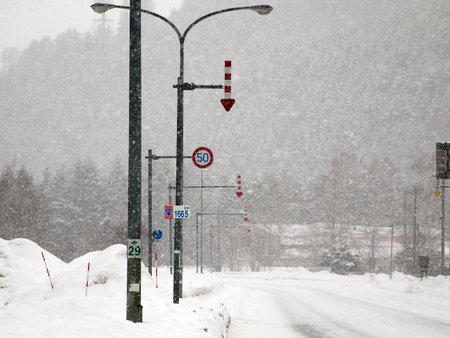 Hokkaido,Japan - February 25, 2023: Fixed-post delineators or fletchings used on a road in Hokkaido, Japanの写真素材