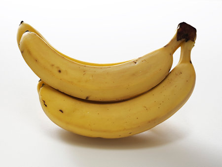 Tokyo, Japan - May 28, 2023: Closeup of bananas on white backgroundの写真素材