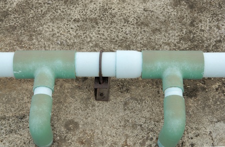 Symmetry old pipe connection with blackgroundの写真素材