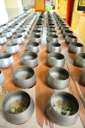 The Buddhist give money into BATの写真素材