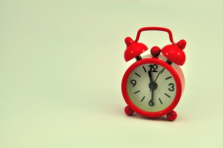 Red clock isolated on white background 