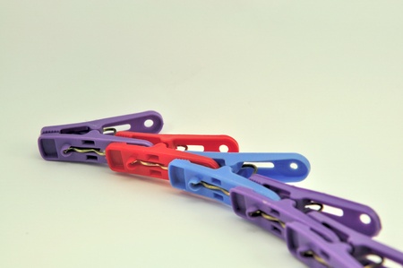 Chain colour clothes-peg isolated on white background の写真素材