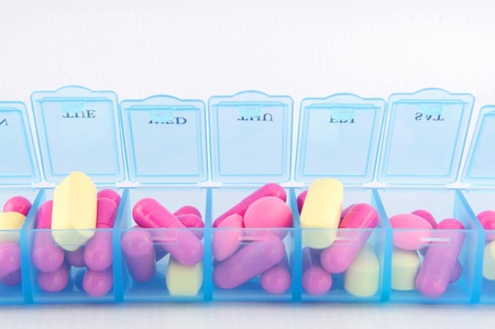Capsule and tablet in daily pill box  show medical conceptの写真素材