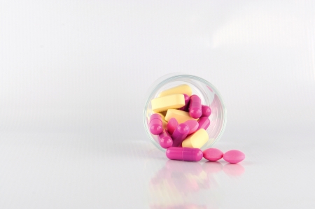 Medicine tablet in dosage glass show medicine conceptの写真素材