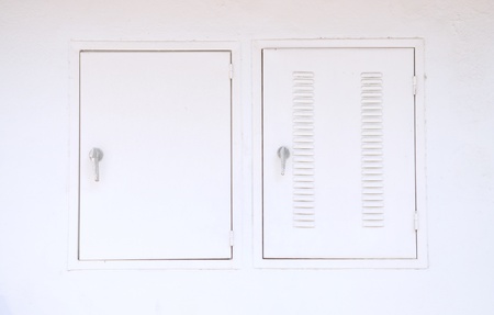 Air vent and window on white wallの写真素材