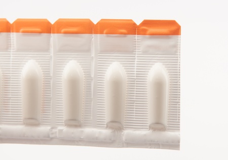 Closed up suppository tablet on white backgroundの写真素材
