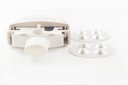 Closed up powder asthma inhaler and capsule in aluminum blister pack