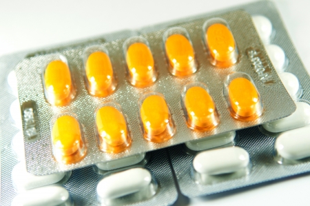 Closed up yellow tablet in blister pack