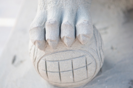 Closed up craw of statue lion in templeの写真素材