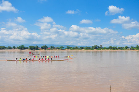 NONGKHAI,THAILAND-OCT 20:Traditional Thai long boats compete at Nongkhai province at Meakhong river on OCT 20, 2013 in Nongkhai ,Thailand. のeditorial素材