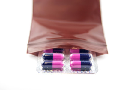 Medicine capsule blister pack in brown dispensing plastic bagの写真素材
