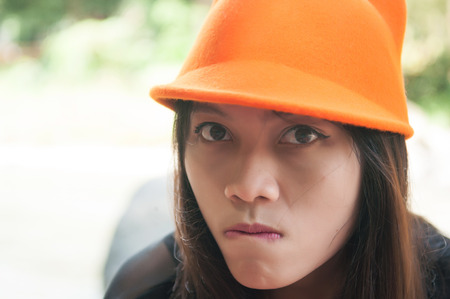 Girl and angry face show emotion conceptの写真素材