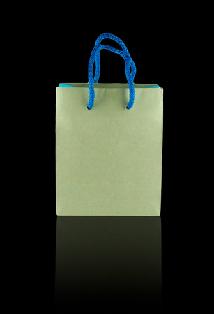 Brown paper bag isolated on black backgroundの写真素材