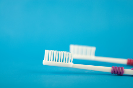 Closed up toothbrush on blue background